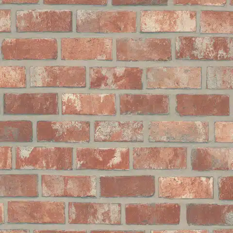 Detailansicht einer roten Ziegelsteinwand mit leicht verwitterter Optik. Die Ziegelsteine haben unterschiedliche Farbtöne von hellrot bis dunkelbraun, während die grauen Fugen für eine realistische Backsteinstruktur sorgen.